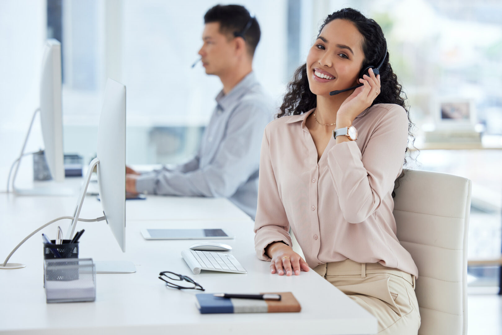 Call center, desk and portrait of consultant woman in telemarketing office for online assistance or help. Computer, contact us and microphone with agent or operator in workplace for customer support